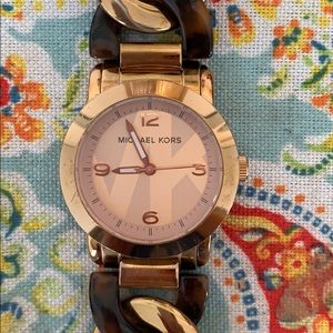 Michael Kohr’s tortoise and gold braided watch